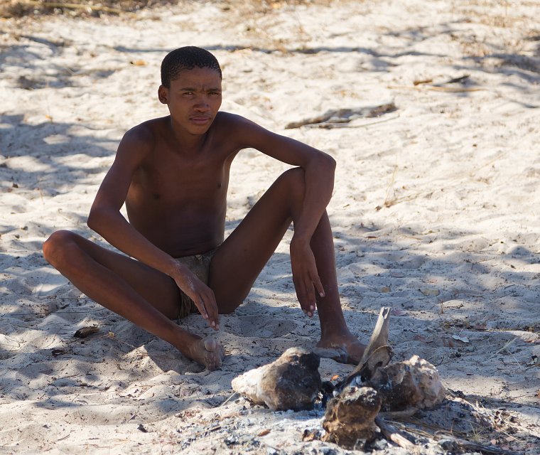 Young Bushman Guarding the Fire | Bushmen People - Grootfontein, Namibia (IMG_5536.jpg)